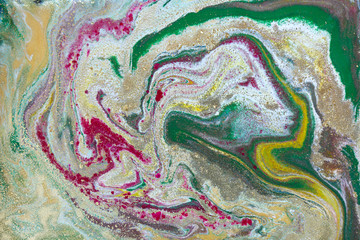 Multicolored gold marbling pattern. Golden marble liquid texture.