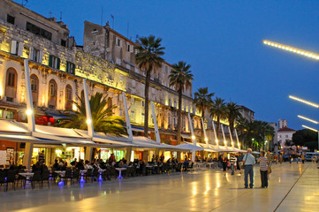 Riva waterfront along the walls of the Diocletian Palace at dusk, Split, Croatia © Marina Marr