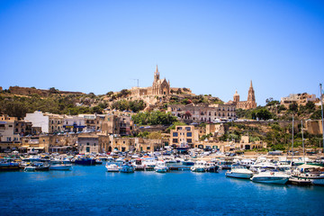 Naklejka premium Beautiful view on Gozo island from a boat, postcard style, beautiful colors landscape - Image