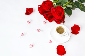 cup of black coffee and red roses
