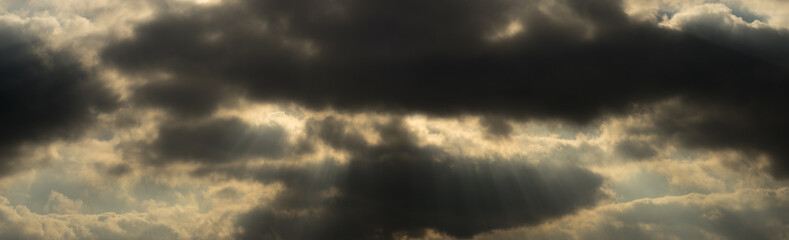 Fototapeta na wymiar Dramatic stormy clouds with sun