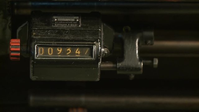 closeup of numerator counting numbers, vintage clock counting, printing press machine, water counter