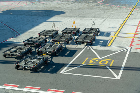 Baggage carrying equipment in runway.