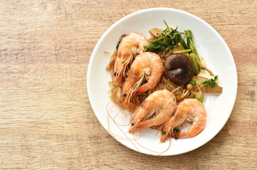 shrimp steamed with glass noodle and ginger on white plate