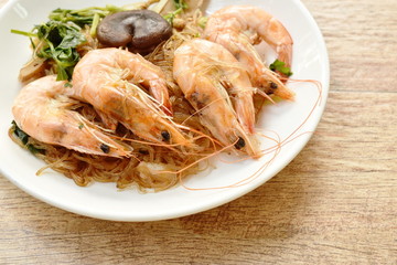 shrimp steamed with glass noodle and ginger on white plate