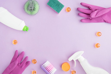  Cleaning tools. Flat lay on purple background. Housework concept. Cleaning Products. 