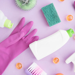  Cleaning tools. Flat lay on purple background. Housework concept. Cleaning Products. 