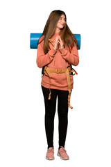 Full-length shot of Hiker girl scheming something on isolated white background