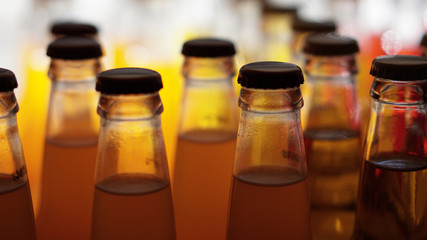 Orange soda in clear bottles