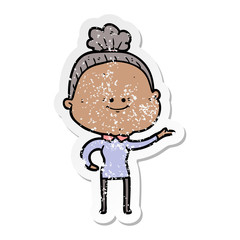 distressed sticker of a cartoon happy old woman
