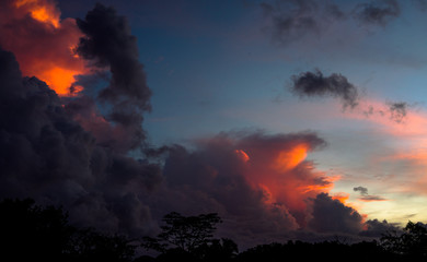Fototapeta na wymiar Sunset in a dramatic clouds