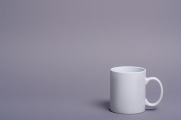 White cup mug drink on gray background