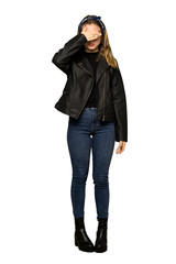 Fototapeta na wymiar A full-length shot of a Teenager girl with leather jacket covering eyes by hands. Do not want to see something on isolated white background