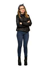 A full-length shot of a Teenager girl with leather jacket with glasses and happy on isolated white background