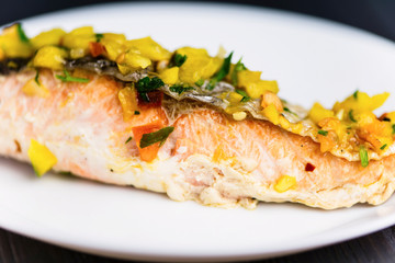 red fish salmon grilled with vegetables and sweet and sour sauce