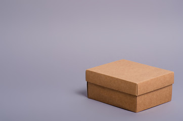 Box brown package minimalism on gray background
