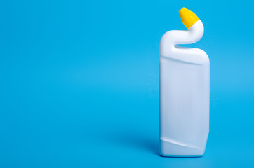 White bottle toilet cleaner on blue background