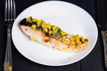 red fish salmon grilled with vegetables and sweet and sour sauce