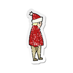 retro distressed sticker of a cartoon person in winter clothes