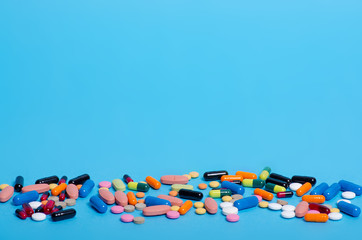 Pills capsule pharmasy medecine on blue background