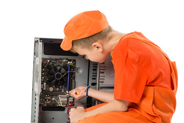 cute boy repairing computer system unit on white background