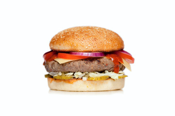  Juicy burger with a big cutlet, cheese, cucumber, tomato, onion, cabbage, sauce and sesame bun on a white background
