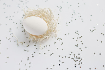 Easter. White Easter Egg. Silver. Bokeh.