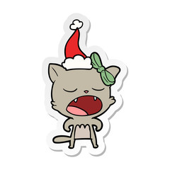 sticker cartoon of a cat meowing wearing santa hat