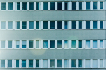 Background of windows of old multistory residential building.
