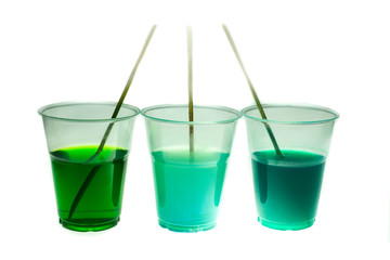 Epoxy resin in cup for casting Stabilizing wood and pine cone hybrid on white background