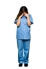 Full body of Young nurse with tired and sick expression