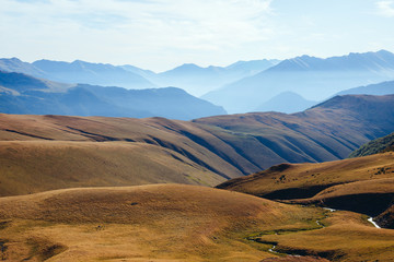 Mountain ranges and mountain plateau at sunrise in autumn