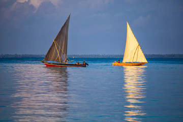 Fototapeta premium Two sailboats on the water surface. Zanzibar island , Tanzania, Africa.