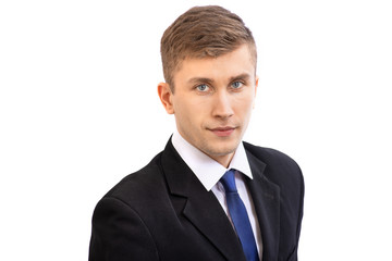 Portrait of young attractive business man in a dark suit and a bright blue tie, isolated on white