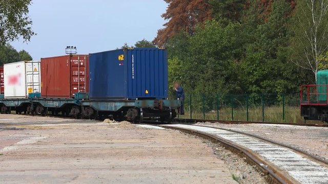 Locomotive with containers. Railway train with containers. Freight train transports containers