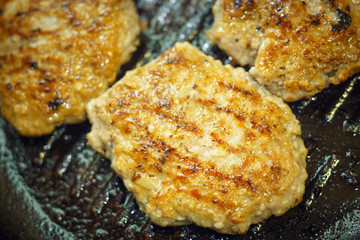 frying cutlets in a pan close-up