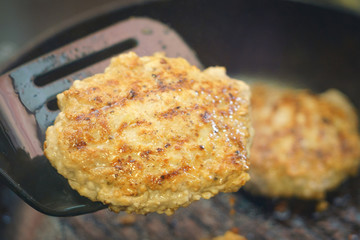 frying cutlets in a pan close-up
