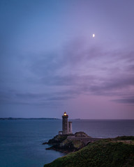 Stunning Petit Minou lighthouse in Brittany in France with moon