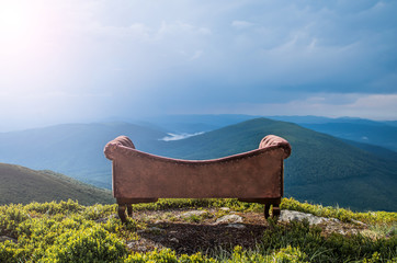 sofa in the mountains. creative. landscape. style 