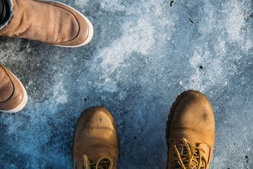 Stylish boots for hiking on ice. Winter concept with copy space