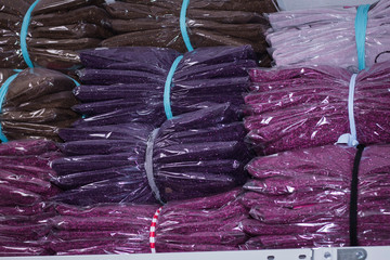 Fototapeta premium Different sizes of clothing in the store on the shelves in the package