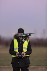 pilot of the drone at work,  video shooting with UAV