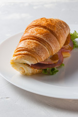 Sandwich with fresh lettuce, cheese and ham.