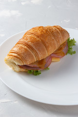 Sandwich with fresh lettuce, cheese and ham.