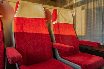 Red seats in first class compartment in czech train