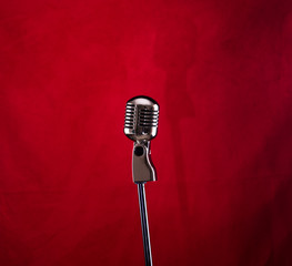 vintage silver microphone on a red stage