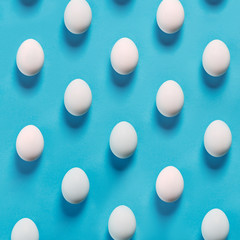 White egg easter on the blue background in center. Design, visual art, minimalist top view copy space