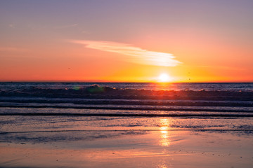 Fototapeta na wymiar Sunset on the Pacific Ocean coastline, Moss Landing, California