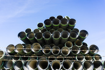 Black plastic pipes in a heap