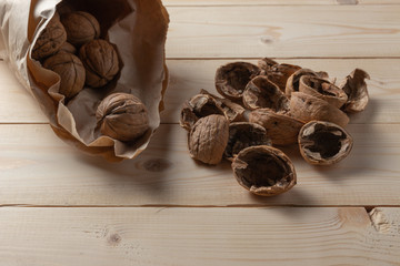 Walnuts on a wooden table.